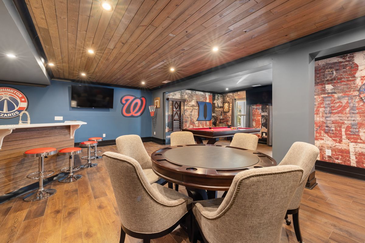 Finished basement with a bar and games area