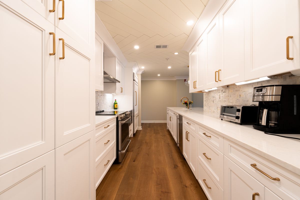Completed kitchen renovation with white cabinetry