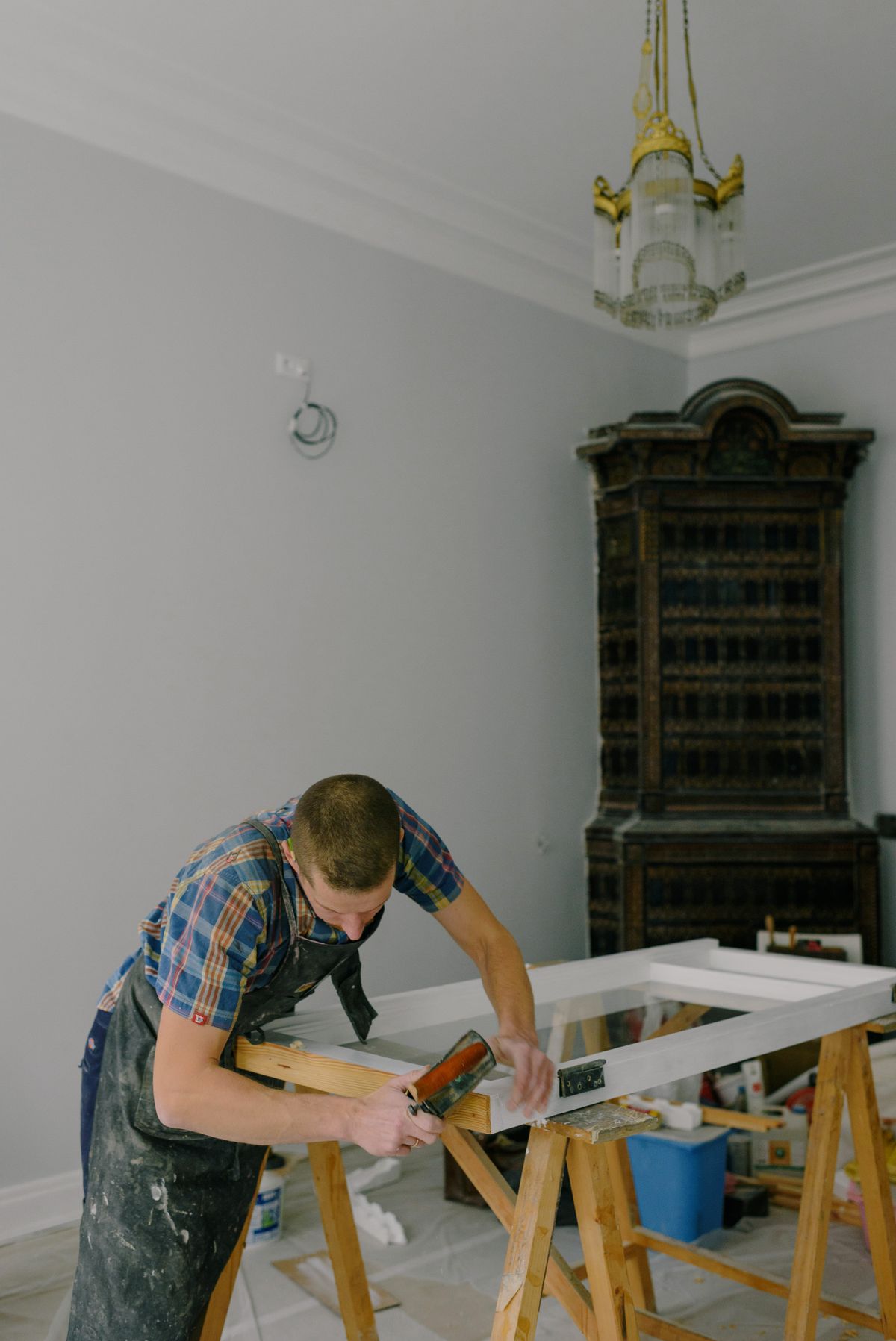 Carpenter fitting a wooden window frame