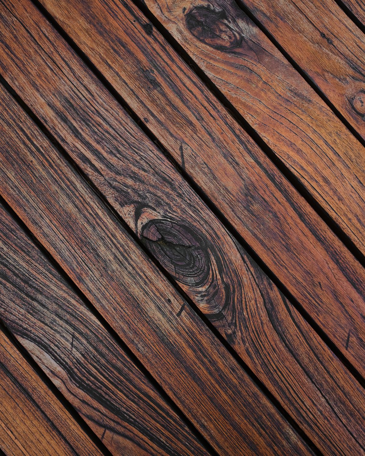 Finished deck boards with a natural grain