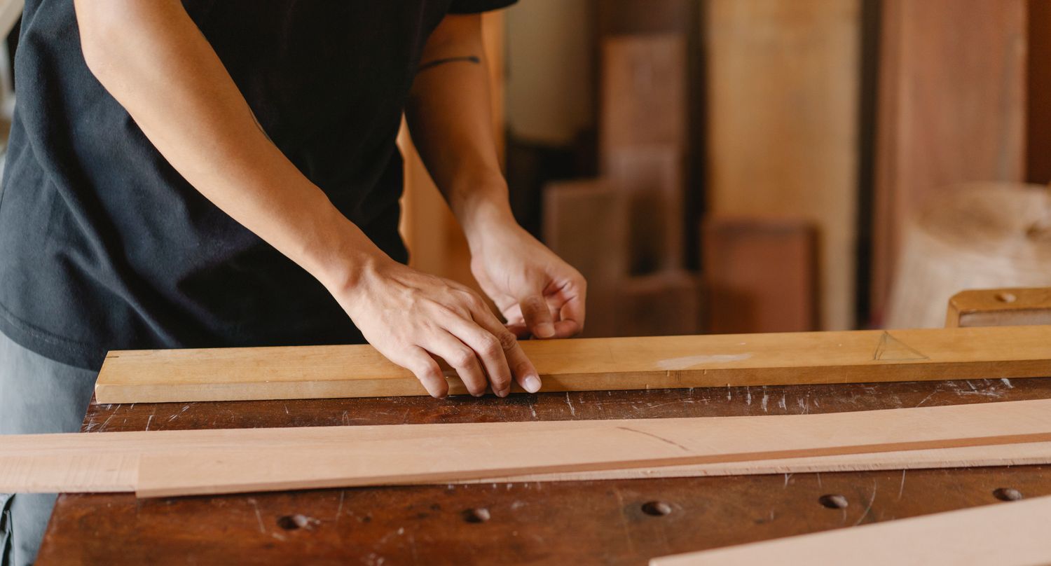 Hand planing a length of timber